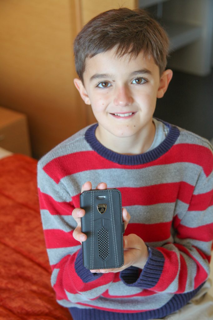 Erik is very happy with his new Lamborghini phone case, but getting smile-fatigue after being in too many photos