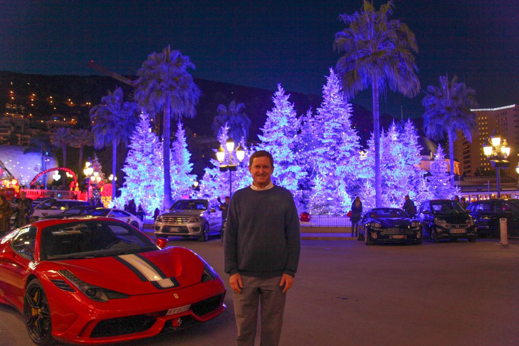 Me looking robotic in front of a nice car and an amazing Christmas display
