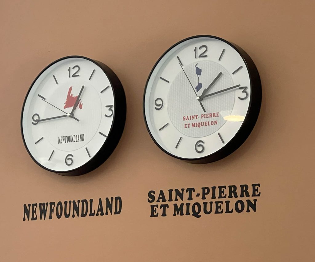 A thirty-minute time change between Newfoundland and Saint Pierre and Miquelon, in the "wrong" direction.  