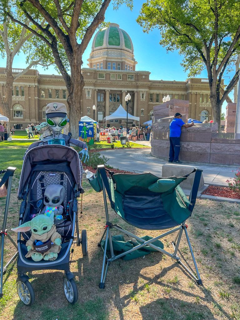 These visitors enjoy their front row seats for the parade