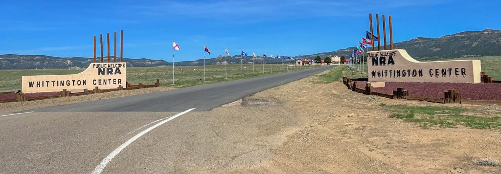 NRA Whittington Center entrance feels like you're entering a United Nations sort of place, but in the boonies of New Mexico.