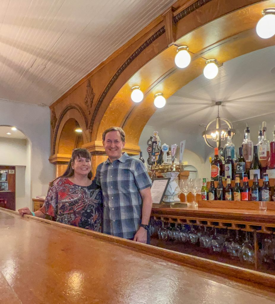A photo of me with the owner of the Tinnie Silver Dollar, with the handcrafted bar in the background