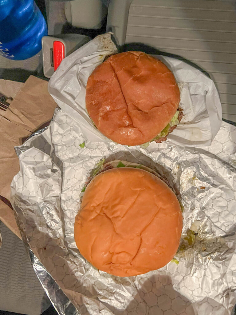 Owl Cafe burger pictured on top and Buckhorn burger pictured below.