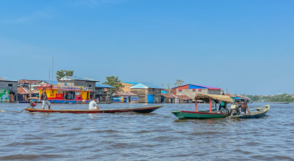 Everybody travels by boat and you can see a floating gas station in the background