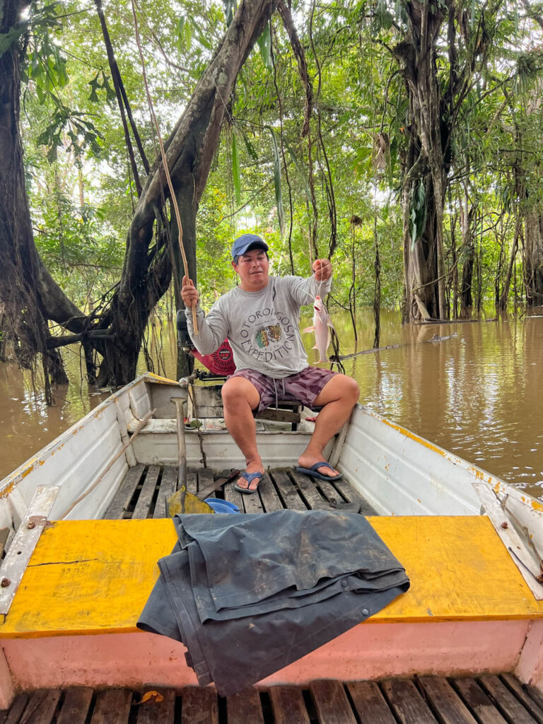 Machete Mike catches yet another fish (he caught a lot).  If I wore what Mike wore on the boat, I would have been covered in bug bites.