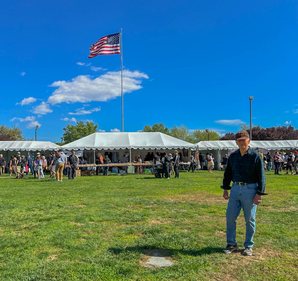 My dad poses for a photo at the festival