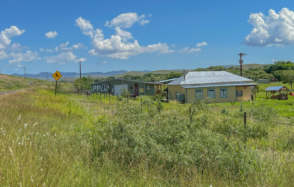 Farms and ranches along the main road, some of which offer fresh produce for sale to passers-by