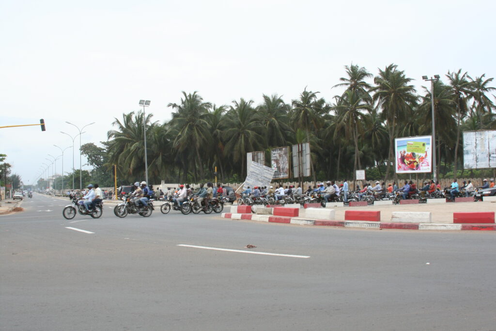 Lots of motorcycles in Togo, unlike Ghana, where they are banned
