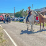 The Miner's Day parade makes its way through White Oaks, New Mexico.
