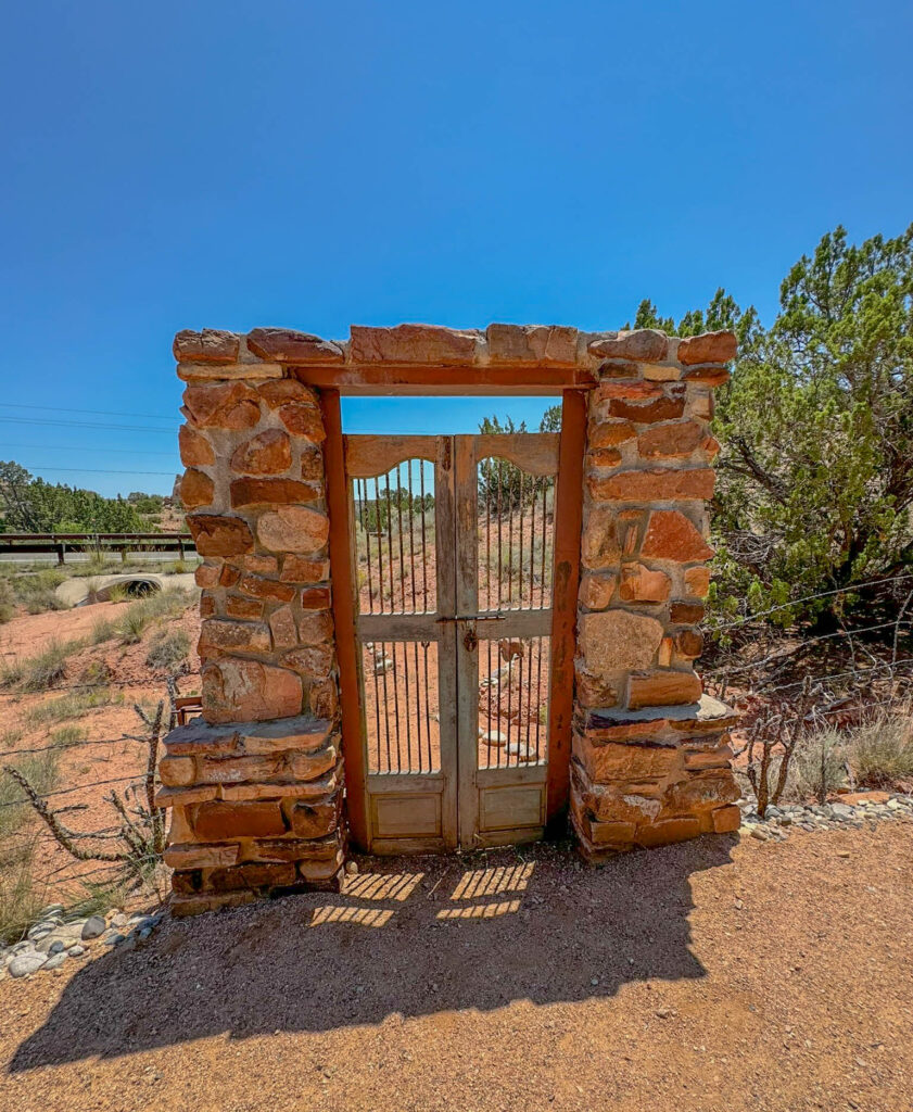 An interesting gate to that leads to the road.