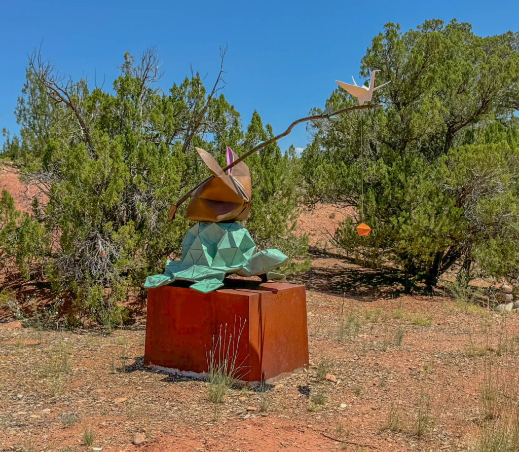 "Caravan" by Kevin Box Studio and Beth Johnson, featuring a crane, rabbit, and tortoise.