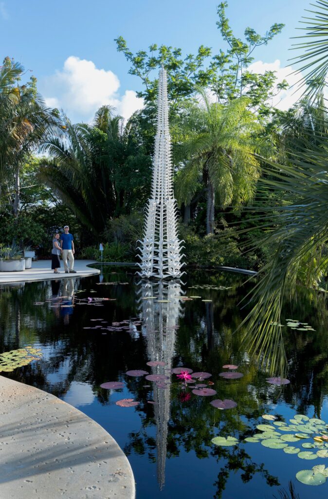 MasterPeace installed in a pond at the Naples Botanical Garden in Naples, Florida, with the 500 cranes reflected in the water.