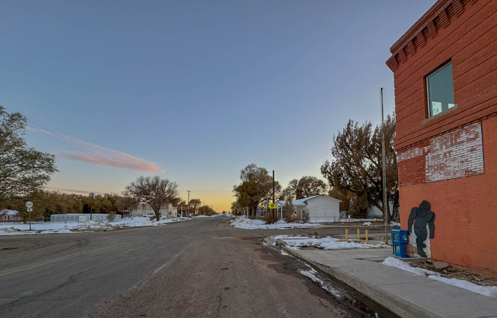 The streets of Maxwell at sunset.  Nobody is out, except Bigfoot.