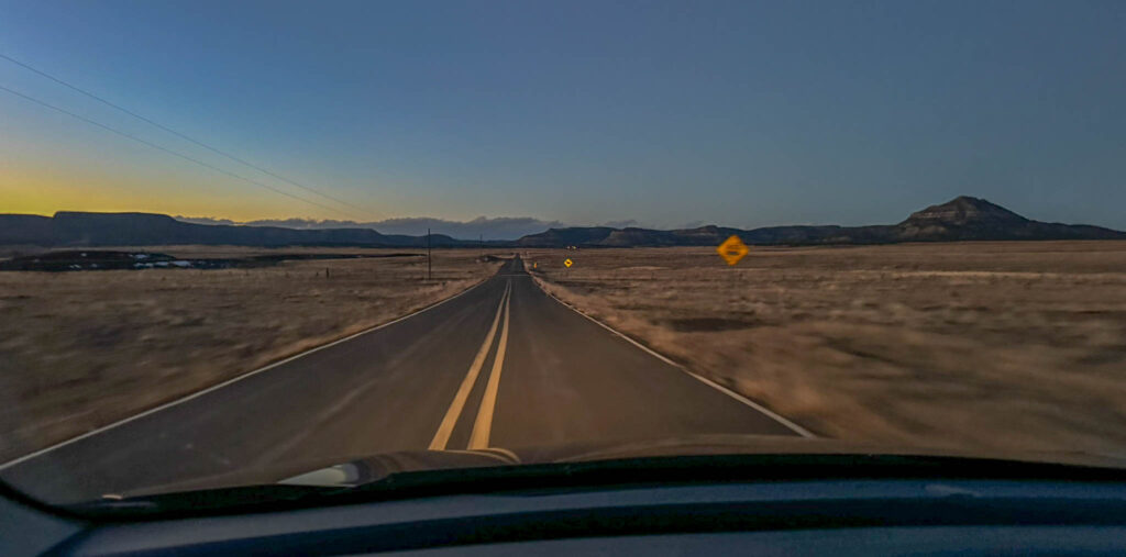 The road to Colfax Tavern and Diner at Cold Beer, NM, the lights in the distance.