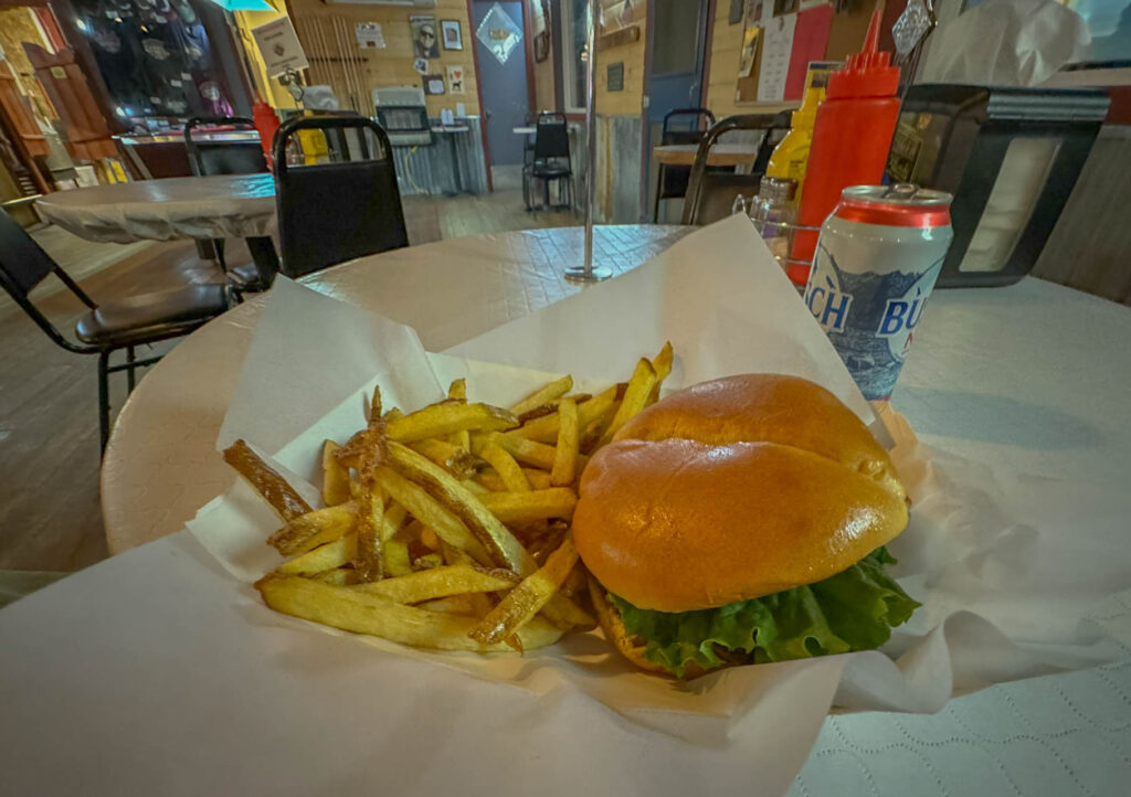 Green chile hamburger, fries, and a Busch Non Alcoholic Beer.