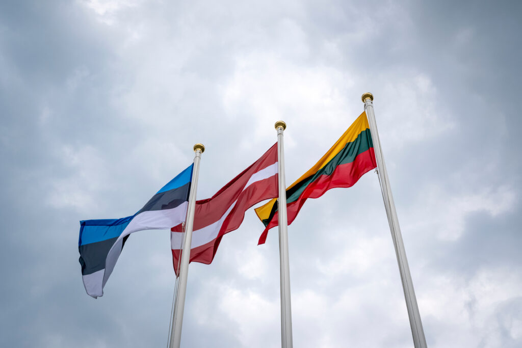 Flags of Estonia, Latvia, and Lithuania (from left to right)