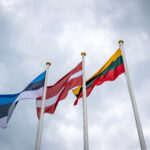 Flags of Estonia, Latvia, and Lithuania (from left to right)