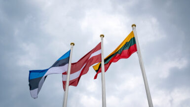 Flags of Estonia, Latvia, and Lithuania (from left to right)