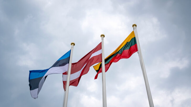 Flags of Estonia, Latvia, and Lithuania (from left to right)