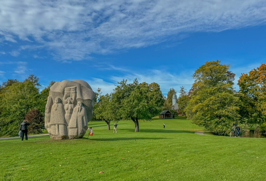 On the flip side of the "Father of Song" statue, there’s a group of singers representing three different generations, each deeply rooted in these songs.