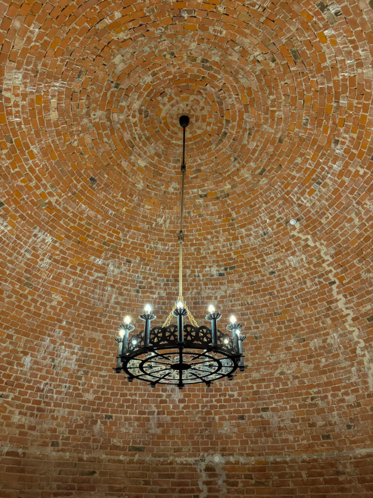 A closer look at the chandelier and ceiling of the main tower at Turaida Castle.