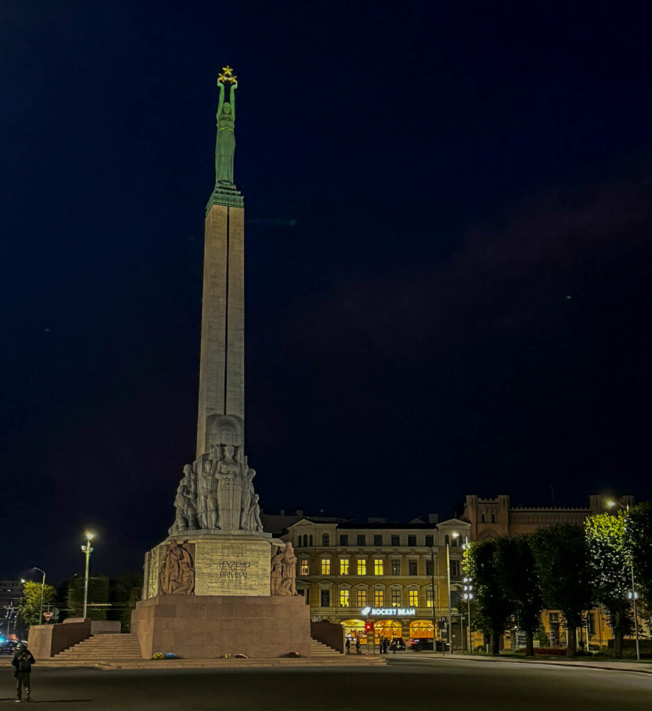 The Freedom Monument (Brīvības piemineklis) in Riga, Latvia, honors the nation’s independence and those who fought for it. Unveiled in 1935, it stands 42 meters tall, made of granite, travertine, and copper. A bronze figure at the top, Milda, holds three golden stars representing Latvia's regions: Vidzeme, Kurzeme, and Latgale. The base showcases sculptures and reliefs of key events, freedom fighters, and cultural symbols. Despite Soviet and Nazi occupations, the monument survived and became a rallying point during Latvia’s push for independence in the 1980s. Now, it’s a site for ceremonies, where visitors often leave flowers. Located near Bastejkalna Park and Old Town, it’s a powerful symbol of Latvia’s spirit.