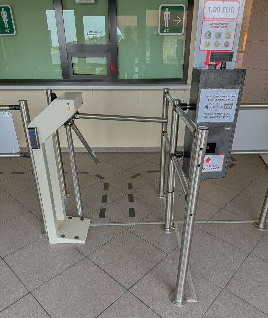 One of those annoying cash-only turnstiles stands guard at the Hill of Crosses visitor center restroom. Thankfully, the gift shop has a staff member on hand, so you probably have some alternatives if you’re not carrying any coins.