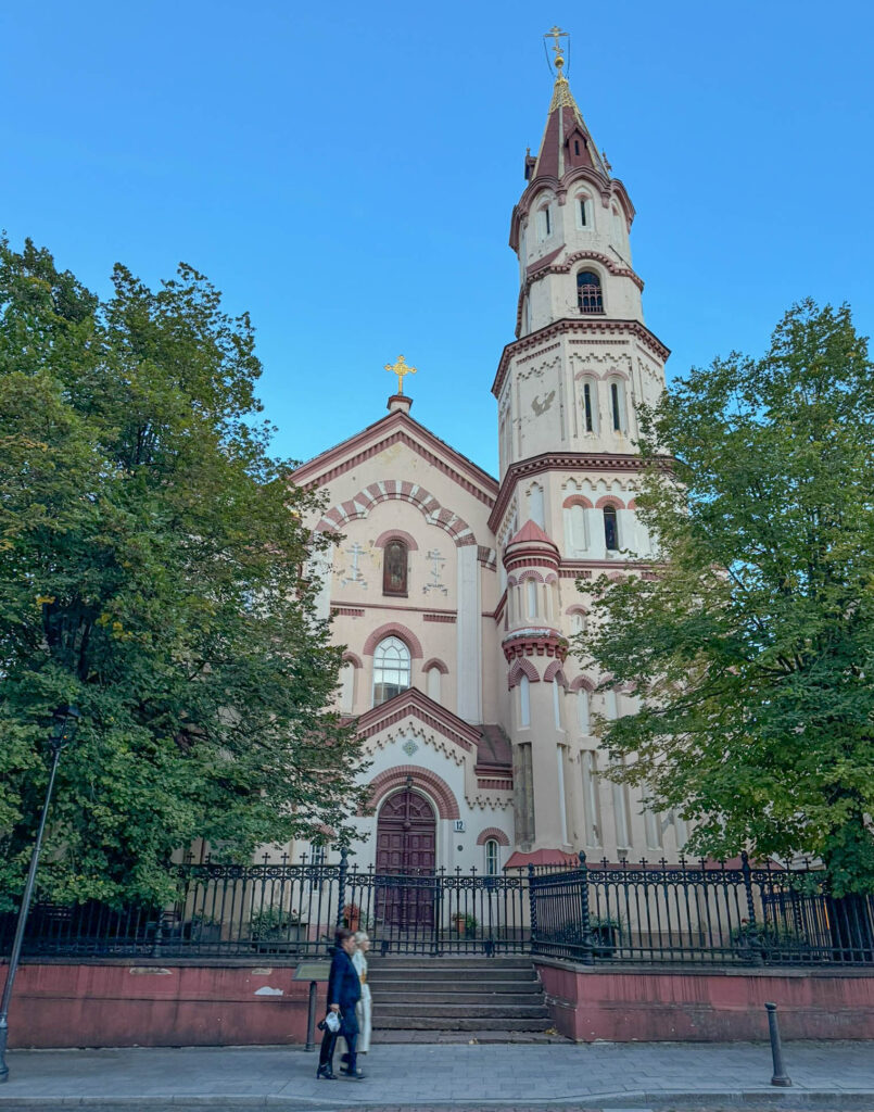 A view of St. Nicholas Orthodox Church (Šv. Nikolajaus cerkvė) in Vilnius Old Town. This church has been standing tall since 1350, making it one of the oldest Orthodox churches in Vilnius. I’m told it’s an example of Neo-Byzantine architecture, not that I would know. Being several centuries old, it's been through its fair share of damage and restorations but it continue to serve as a spiritual home for the Orthodox Christian community in Vilnius. The church is dedicated to Saint Nicholas the Wonderworker - the same saint who inspired Santa Claus lore.