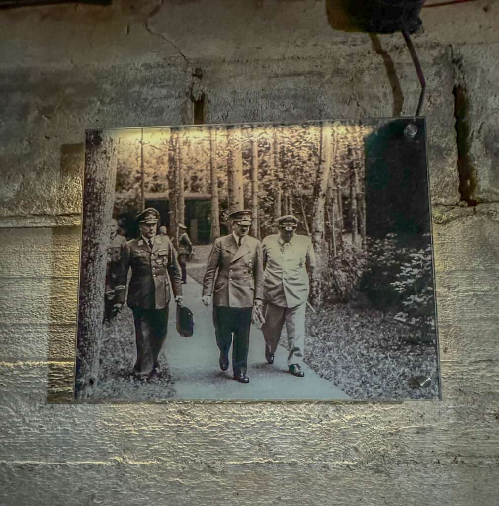 A phot of Hitler walking along the path at the Wolf's Lair