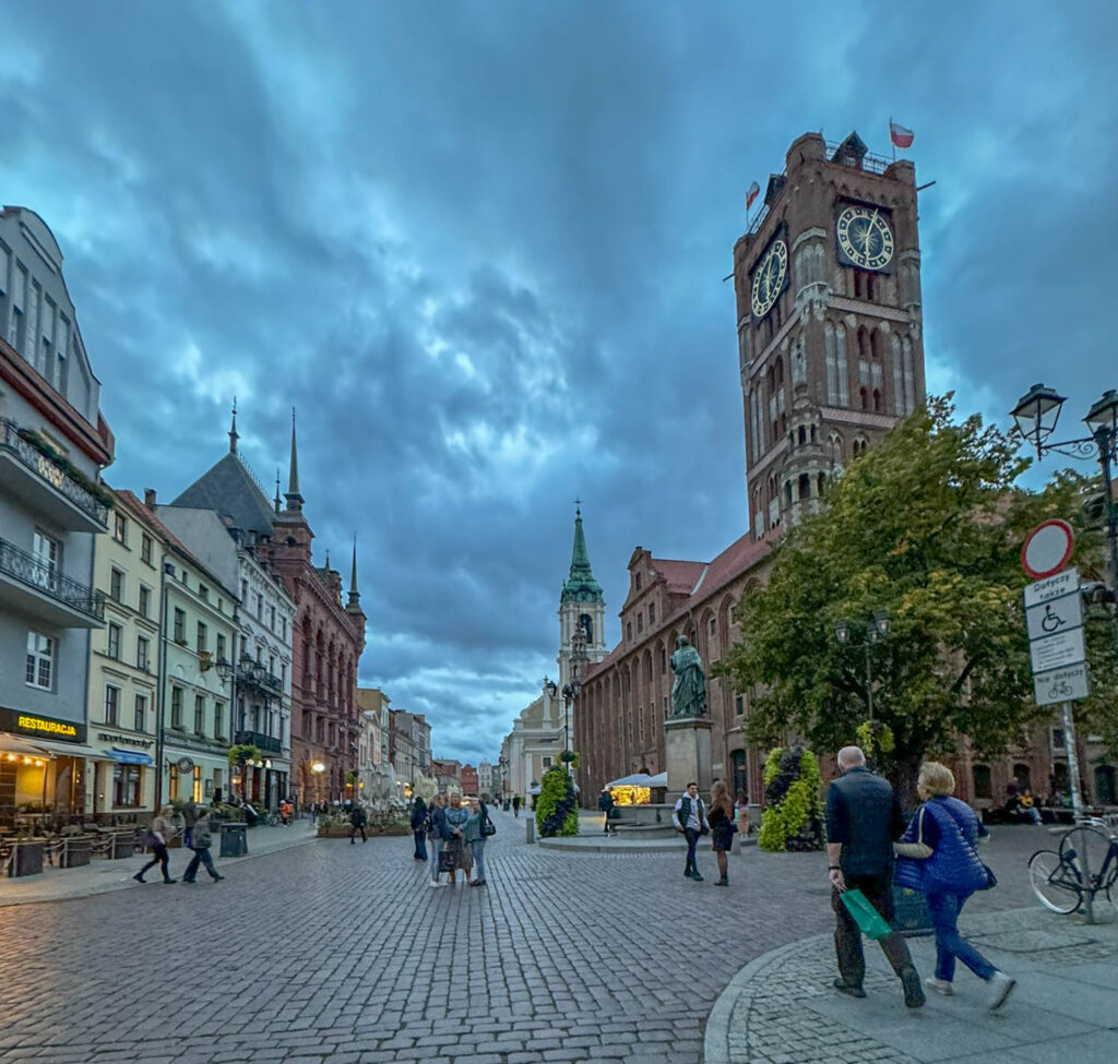 If you glance to the right side of the photo, just behind the Nicolaus Copernicus statue, you’ll notice Toruń’s Old Town Hall. Dating back to the 13th century, this Gothic gem served as the city’s hub for business and politics, it’s now home to the District Museum, where you’ll find medieval artifacts and local history. You also have the option to climb to the top of the clock tower for some great views of the city.