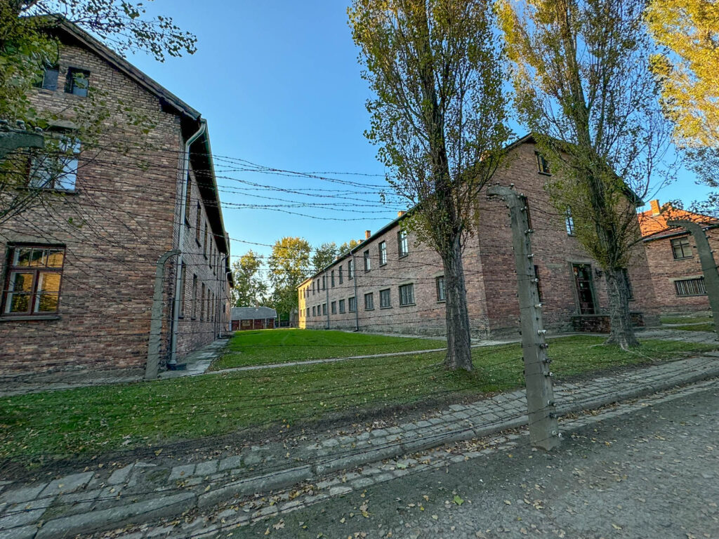 This photo captures part of Auschwitz I, the heart of the Auschwitz camp system in Poland. Originally built as Polish military barracks, it was later repurposed into a Nazi concentration camp. The brick buildings here served various grim functions—housing prisoners, running administrative operations, and even conducting medical experiments. Today, many of these buildings have been transformed into museum exhibits, forming part of the Auschwitz-Birkenau Memorial and Museum.