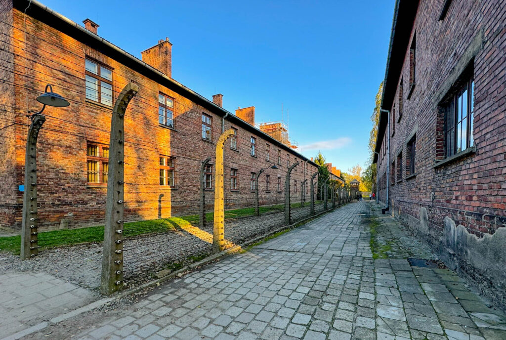 Another view of the electric fence separating the prisoner barracks from administrative offices at Auschwitz.