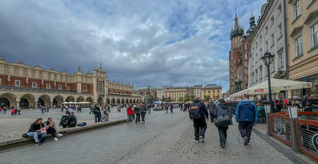 A closer look at Cloth Hall (Sukiennice), a historic market hall located in Kraków’s Main Market Square (Rynek Główny). Originally built in the 14th century as a center for international trade, it has served as a marketplace for centuries. Today, the Cloth Hall houses stalls selling traditional Polish handicrafts, souvenirs, and jewelry on the ground floor, while the upper floor features the Sukiennice Museum, a branch of the National Museum showcasing 19th-century Polish art.