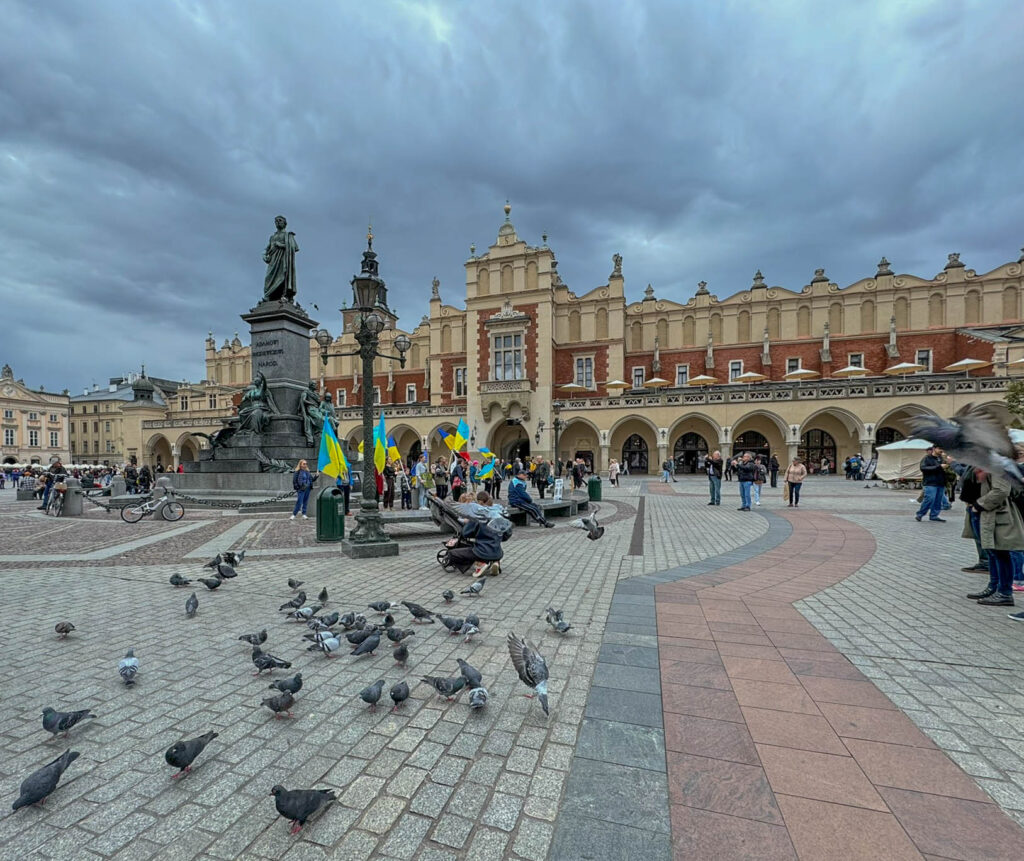 A closer look at the Adam Mickiewicz Monument (Pomnik Adama Mickiewicza) in Kraków’s Main Market Square (Rynek Główny).