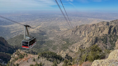 The Sandia Peak Tram glides toward the top, reaching an impressive height of 10,378 feet. From up there, you’re treated to sweeping views of Albuquerque sprawled below and the rugged, sun-soaked shrublands stretching out to the west.