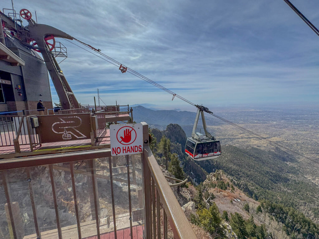 Passengers arriving safely at the upper tram terminal, just like the over 12 million visitors who've taken the ride before them. 