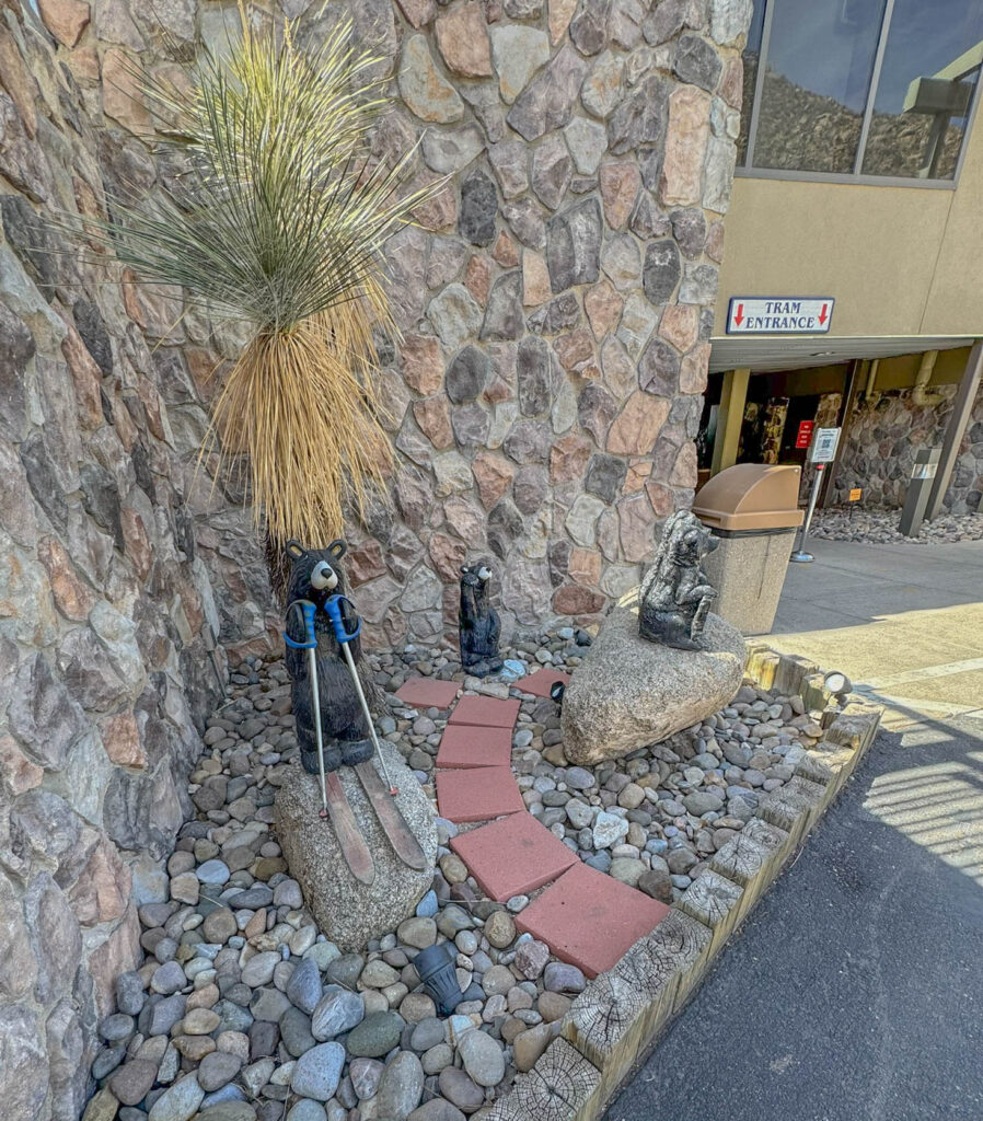 A group of skiing bears wishes you well as you make your way to the Sandia Peak Tram entrance.