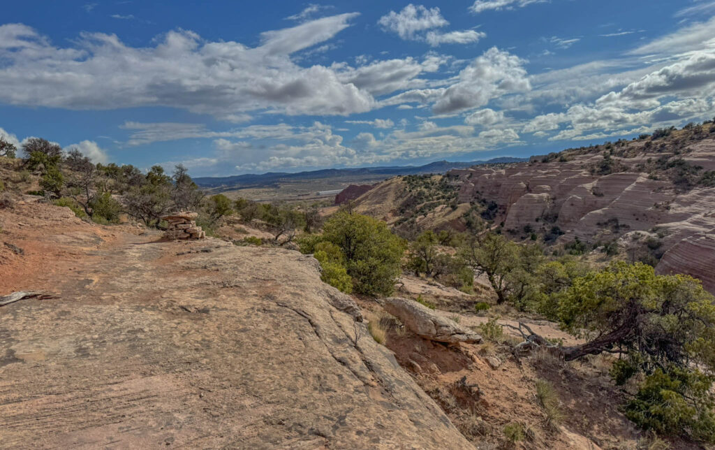 From this vantage point, you can spot the Church Rock Trail parking area in the distance—proof that while the landscape feels remote, you’re never too far from your starting point.