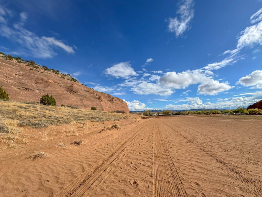 The final straightaway back to the Church Rock Trail parking lot—flat, sandy, and a good stretch to soak in the last views before calling it a day.