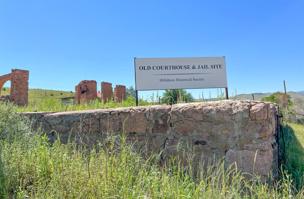 Ruins of the old courthouse and jail in Hillsboro, New Mexico — preserved by the Hillsboro Historical Society as a reminder of the town’s frontier-era role as a regional center during the silver mining boom.