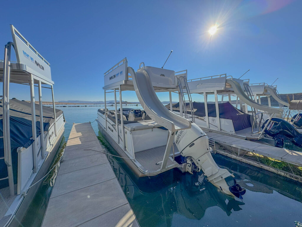Some of the boats available for rent at Marina del Surāincluding double-decker pontoons with waterslides, because why not make a splash?