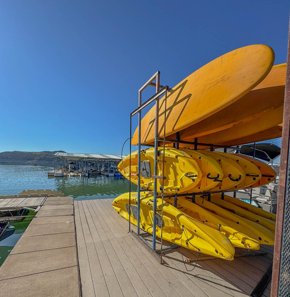 Kayaks and paddleboards ready to go at Marina del Sur. A great way to explore the lake at your own pace.