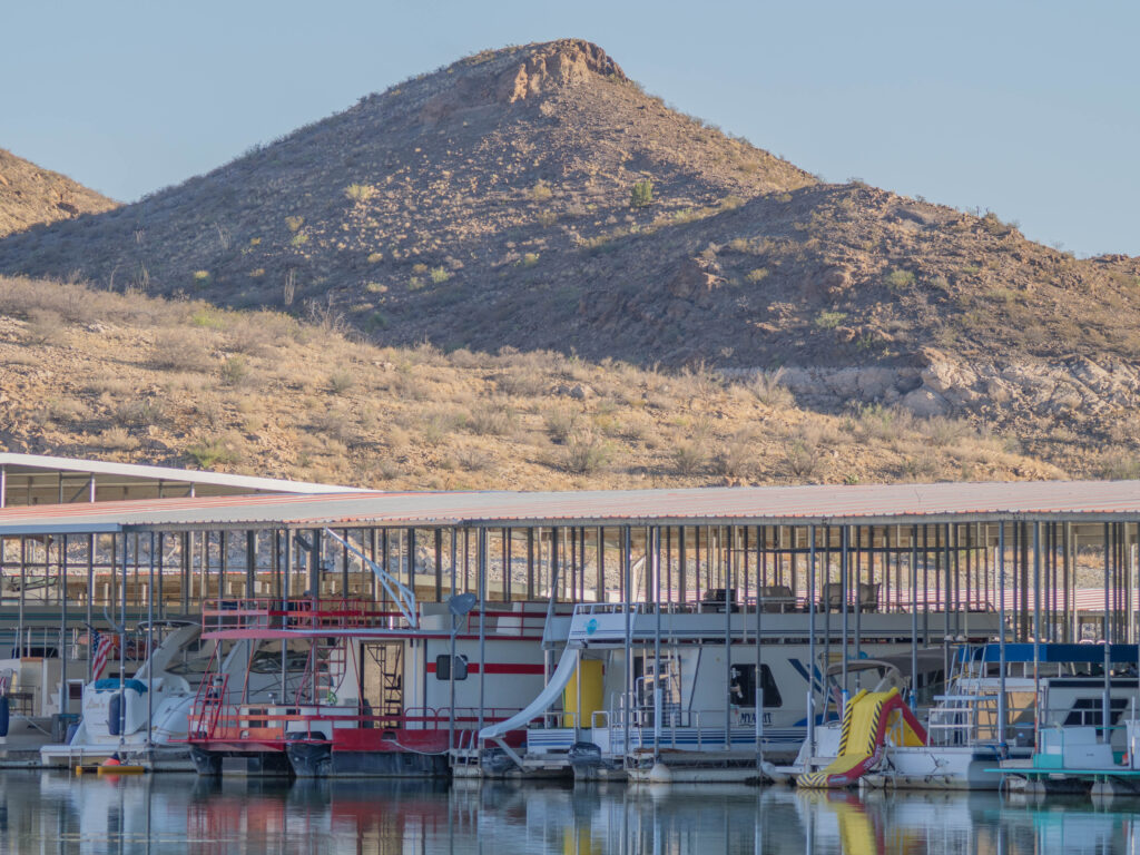 Slip rentals at Dam Site Marinaāhome to houseboats, weekend cruisers, and floating slides for kids and kids at heart.