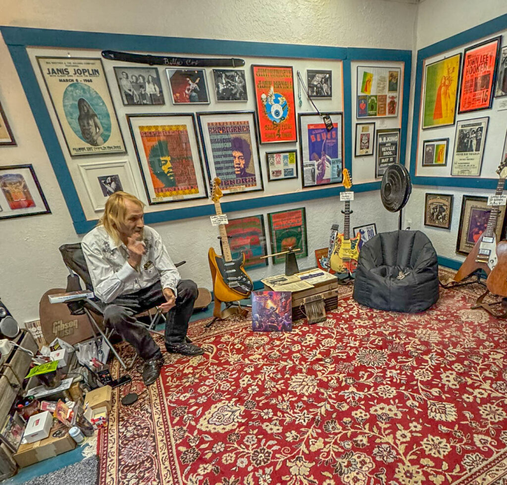 James Lane sharing stories inside the Carrizozo Rock and Roll Hall of Fame Museum, where the memorabilia is only half the experience.