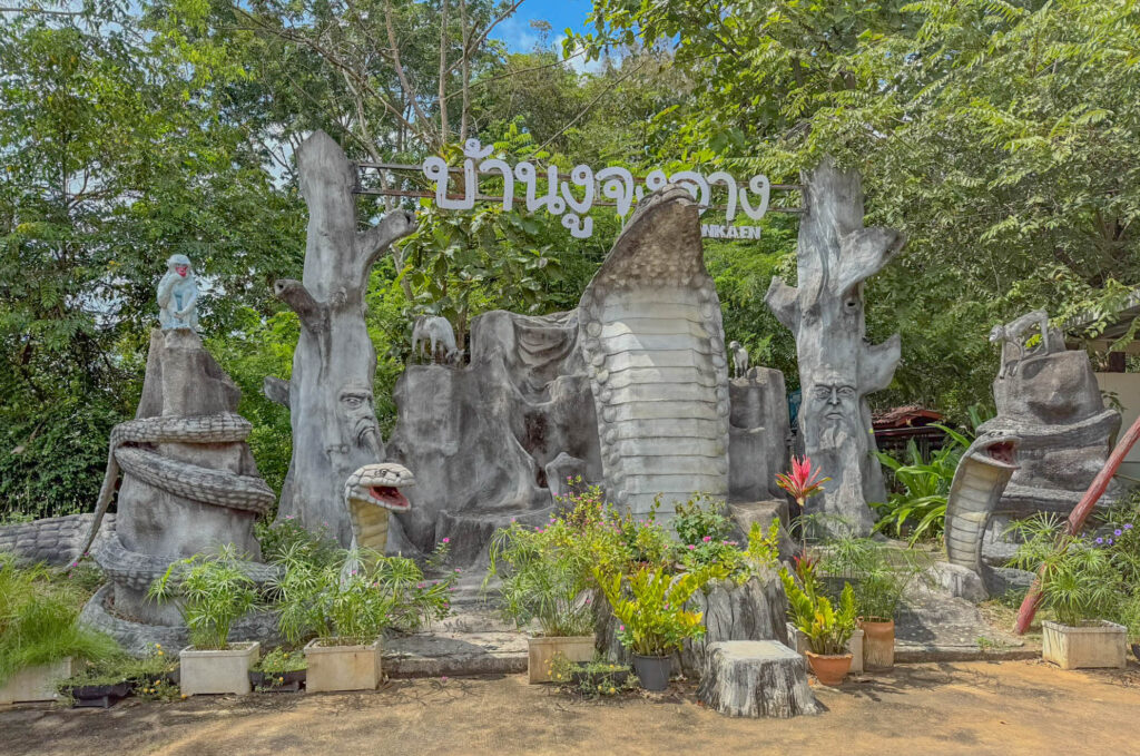 Giant cobra sculptures welcome visitors to King Cobra Village.