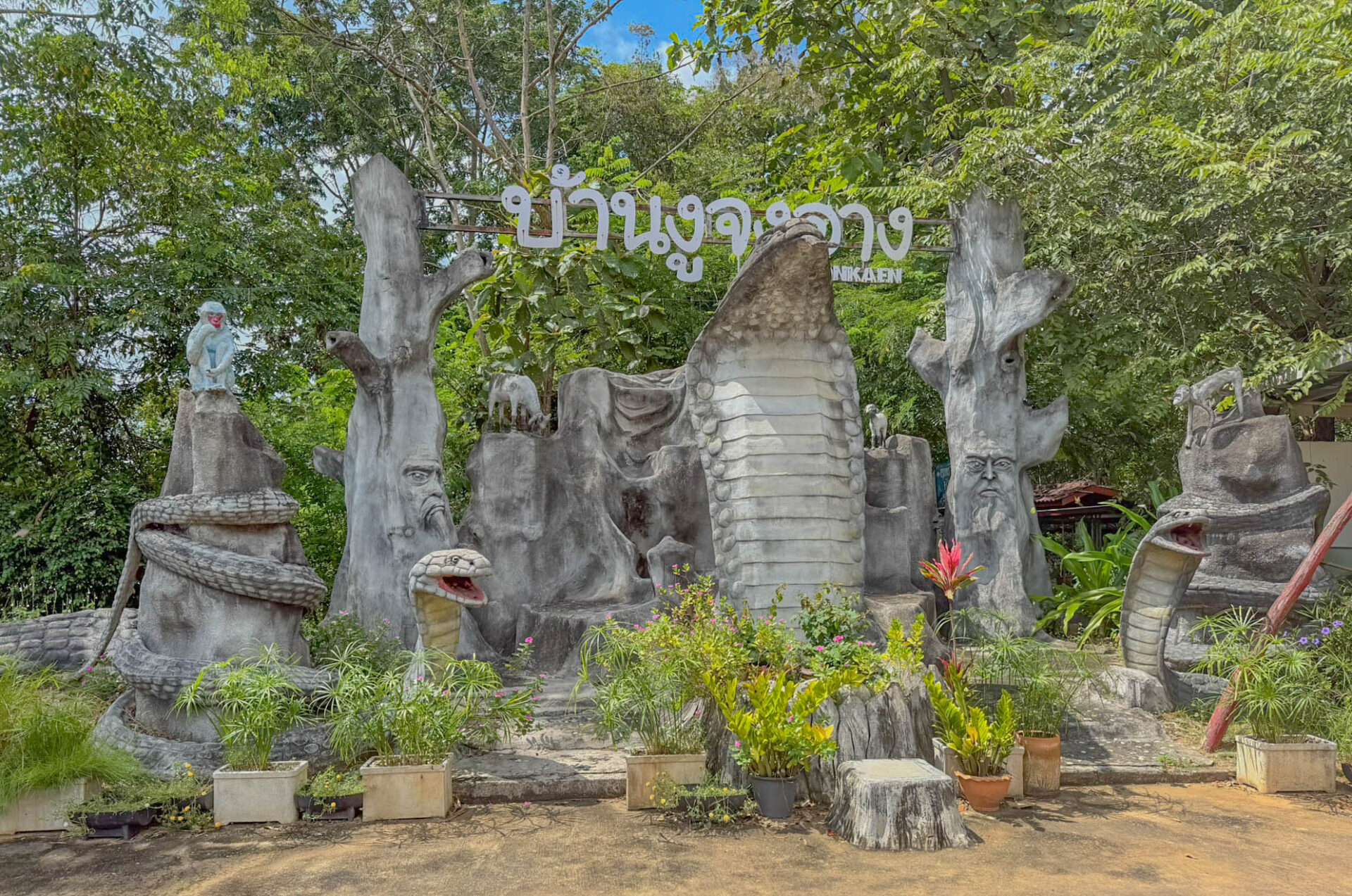 Giant cobra sculptures welcome visitors to King Cobra Village.