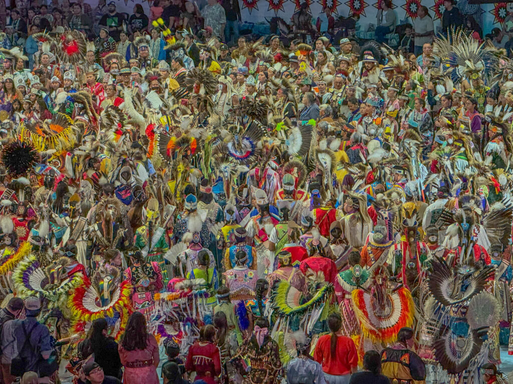 By the time Grand Entry was fully underway, the arena floor inside Tingley Coliseum was almost completely filled with dancers from across North America.
