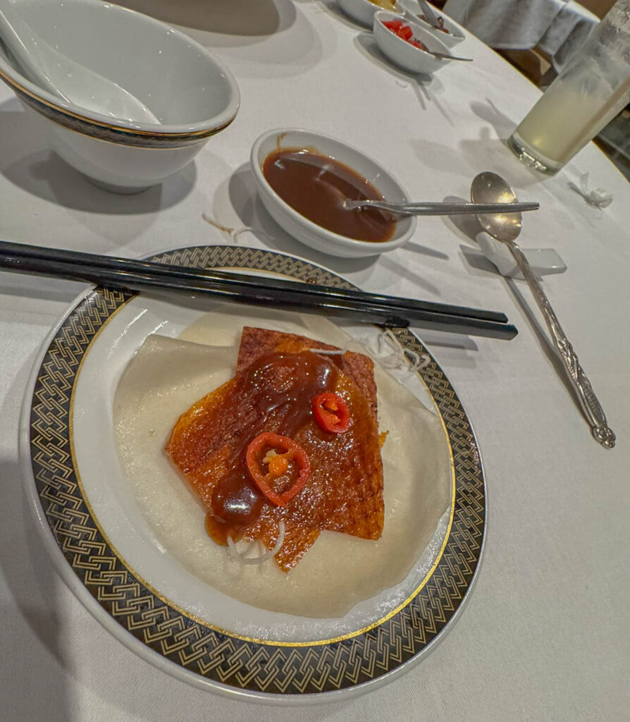 Going with the flow.  Enjoying some crispy duck skin wrapped in a thin pancake.