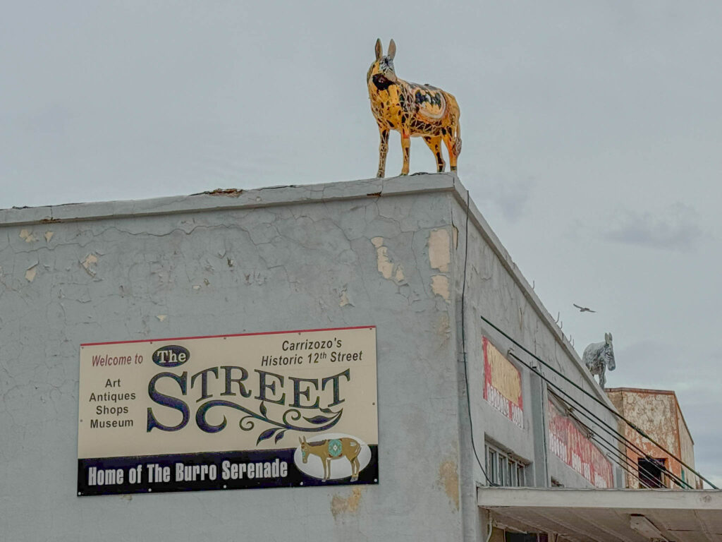 A painted burro standing watch above Carrizozo’s historic 12th Street.