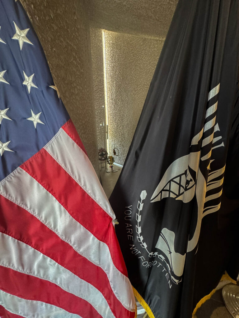 The American and POW/MIA flags inside the Peace and Brotherhood Chapel.